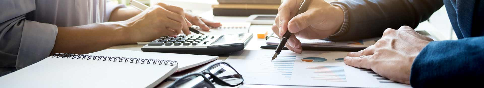 Business meeting with documents and calculator